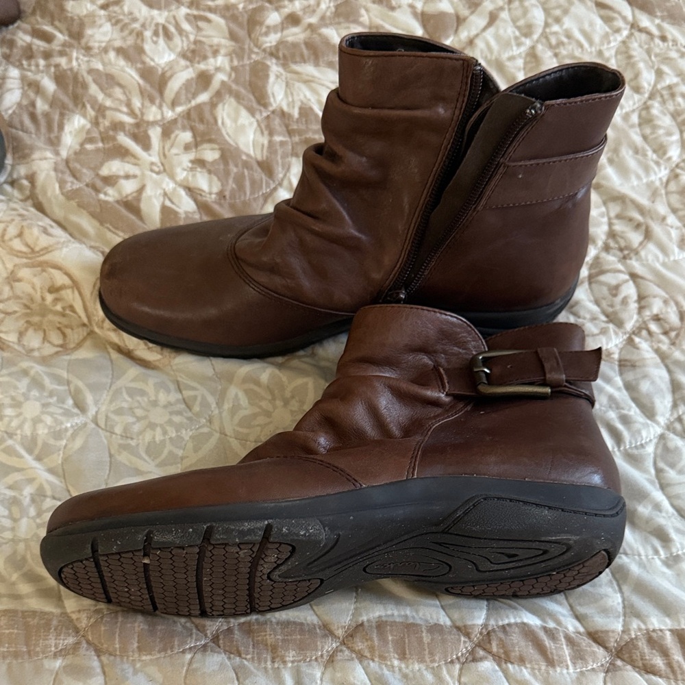 This is a Clarks Chris Sydney women's boot in brown leather with textured sole.